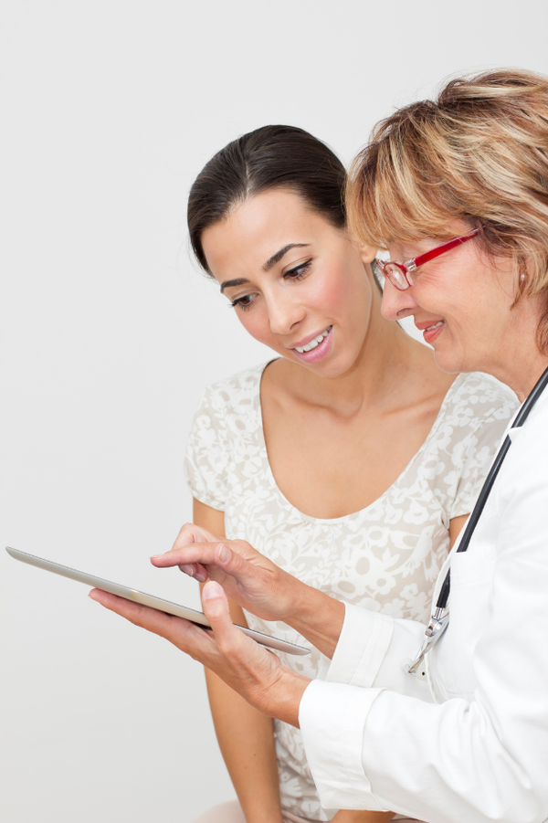 Doctor reviewing health check results with patient